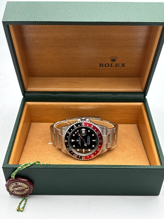 Rolex GMT-Master II Coke 16710 de 2003 avec sa boîte Rolex, lunette noire et rouge